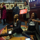 Rep. Tray McCurdy, D-Orlando and Rep. Angie Nixon, D-Jacksonville sit on the Florida Seal in protest as debate stops on Senate Bill 2-C: Establishing the Congressional Districts of the State in the House of Representatives Thursday, April 21, 2022 at the Capitol in Tallahassee, Fla. The session was halted on the protest.